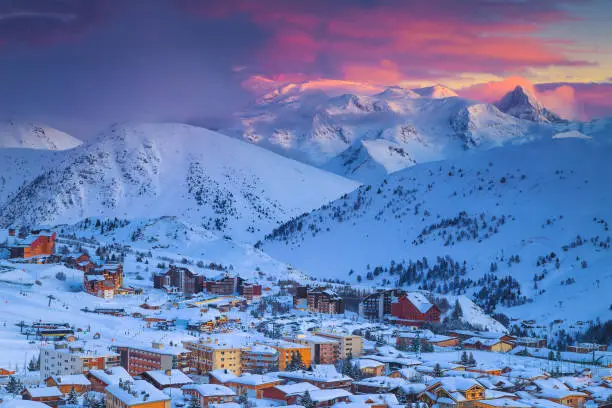 Photo of Fantastic winter ski resort at sunset in the French Alps