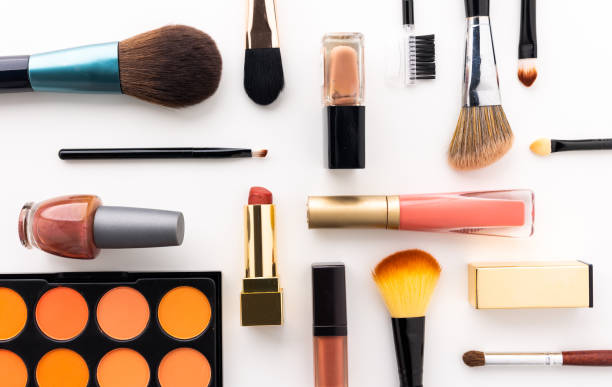 istock Plenty of makeup on the white table with eyelash brush, eye shadow, lipstick. 1292219718