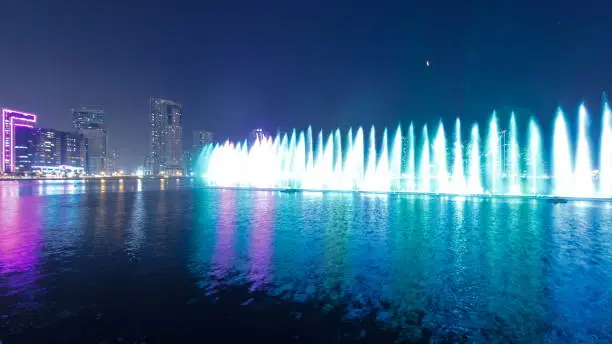 Photo of Evening Musical fountain show. Singing fountains in Sharjah timelapse, UAE