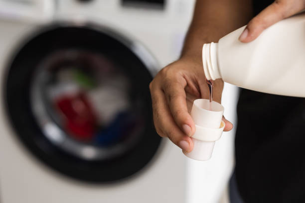 istock Pour some laundry detergent on the clothes and put it in the was 1292219799
