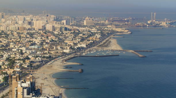 istock Panoramic view of Sharjah coastline from Ajman rooftop timelapse - third largest and most populous city in United Arab Emirates 1292219921