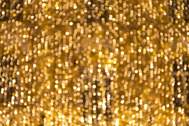 istock Magic abstract background with yellow bokeh lights 1292220756