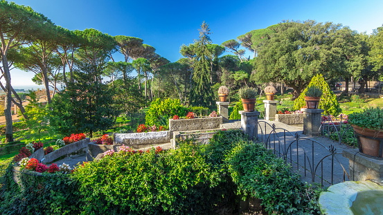 Villa Doria Pamphili park in beautiful town of Albano Laziale , Italy. Green trees and warm light