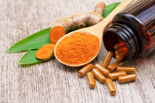 istock Turmeric powder capsules 1292221650
