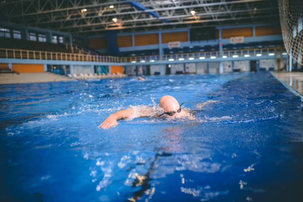 istock Fit swimmer training in the swimming pool 1292221767