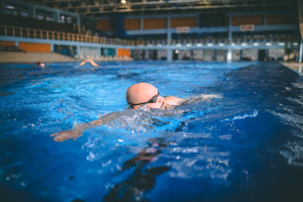 istock Fit swimmer training in the swimming pool 1292221809