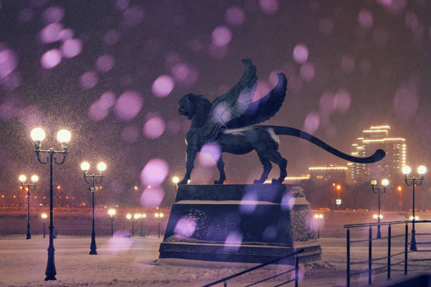 In the background a statue of Bars near the Kazan Registry Office. KAZAN, RUSSIA — DECEMBER 17 2020