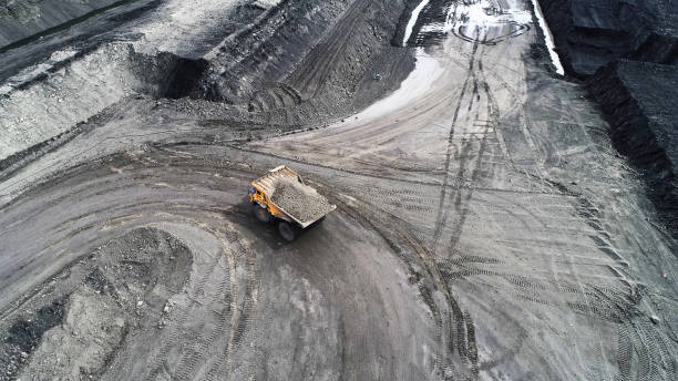 istock mining truck is driving along a mountain road. 1292223024