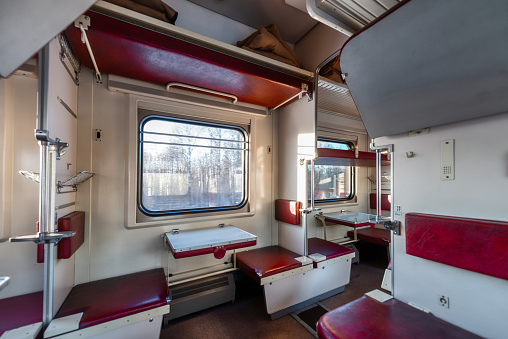 The interior of the car economy class, empty passenger car. Moving train