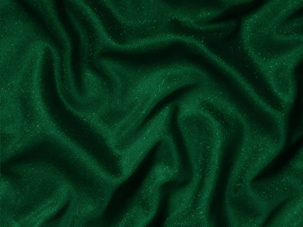 istock Shiny green emerald crumpled fabric texture. Elegant cloth background 1292225615
