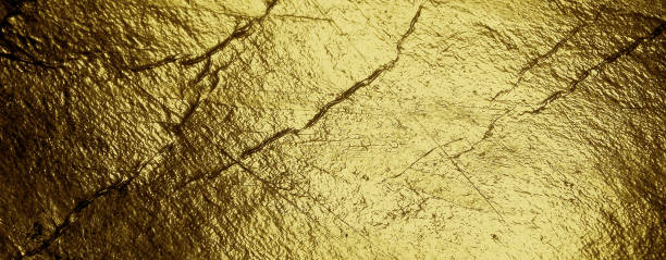 istock Grunge gold foil texture background with cracks and scratches 1292225658