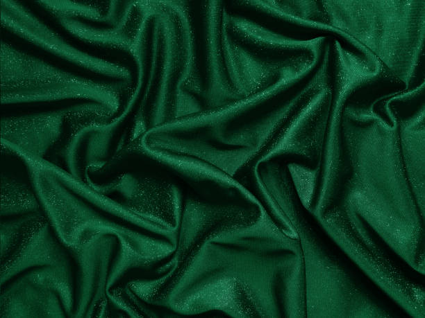 istock Shiny green emerald crumpled fabric texture. Elegant cloth background 1292225663