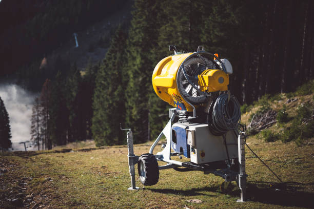 Snow canon on ski slope ready for winter.