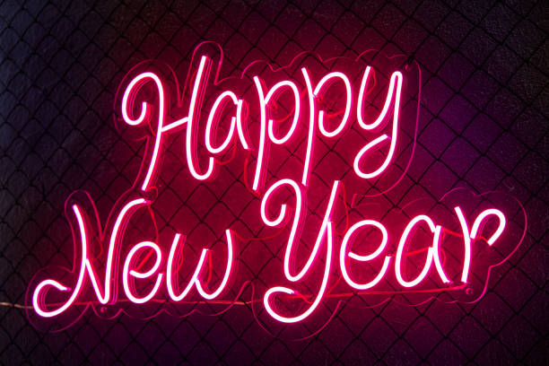 istock Abstract colored lifht bright neon text Happy New Year 1292225799