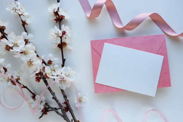 istock flowering branch with white flowers on a blue background and space for text. congratulation. invitation 1292226755