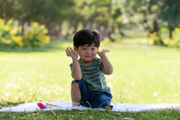 istock Asian little child having fun playing in the park 1292228693