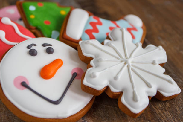 istock Gingerbreads with different decorations from confectionery mastic, blurred background 1292229689