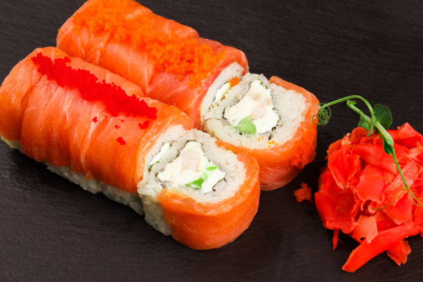 istock Japanese food: Set of different salmon sushi and rolls 1292229801