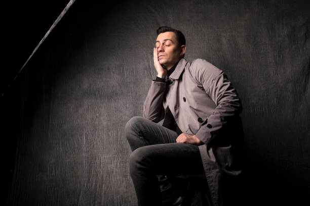 istock Bored Male model with dark grey background 1292230677