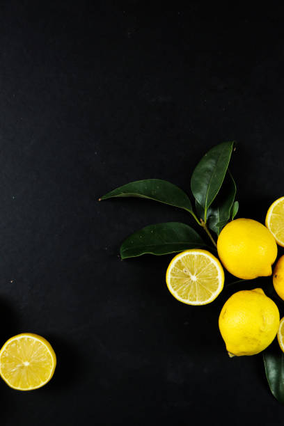 istock Group of lemons with leaves, isolated on background 1292231771