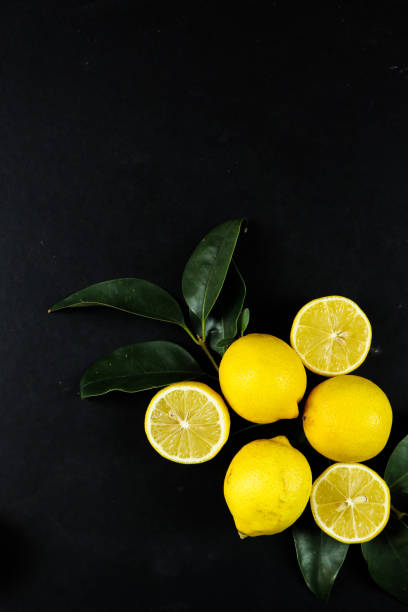istock Group of lemons with leaves, isolated on background 1292232480