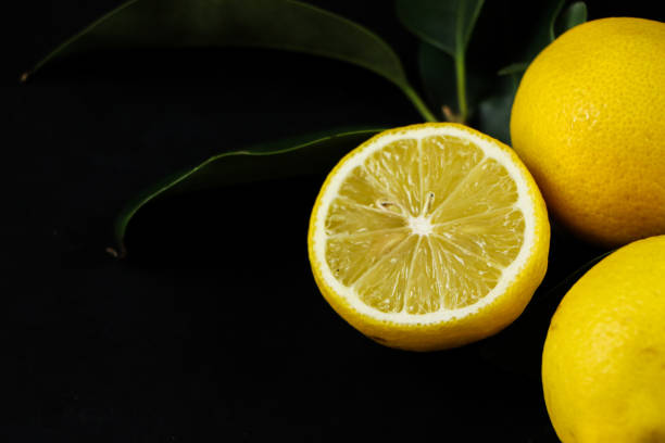 istock Group of lemons with leaves, isolated on background 1292232652