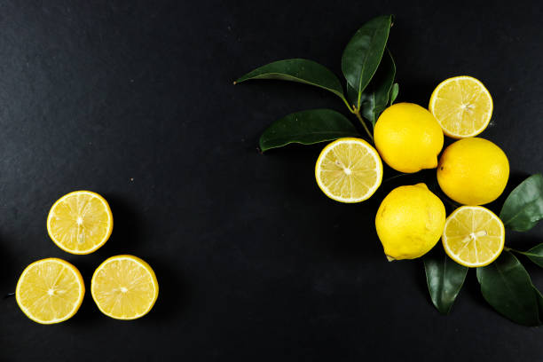istock Group of lemons with leaves, isolated on background 1292233254