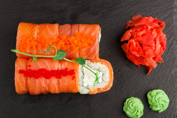 istock Japanese food: Set of different salmon sushi and rolls 1292233358