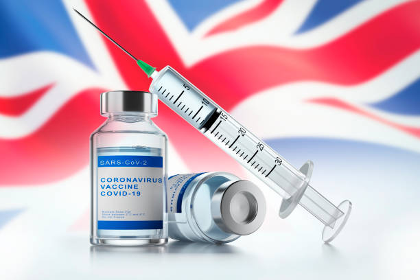 istock Medical syringe with vaccine - UK 1292234412