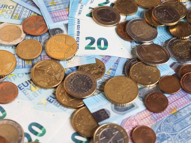 istock Euro notes and coins, European Union 1292235107