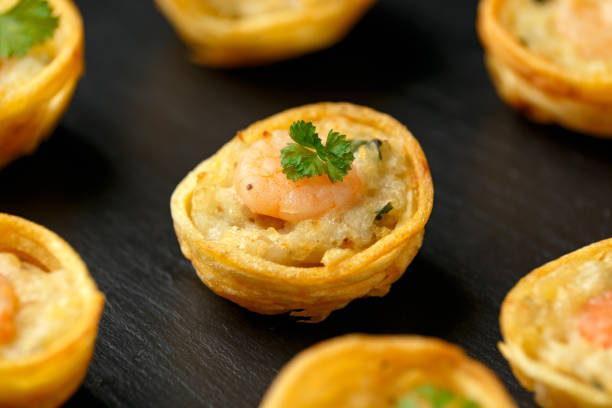 istock Mini party Fish Pie Food with prawn on rustic stone background 1292235499