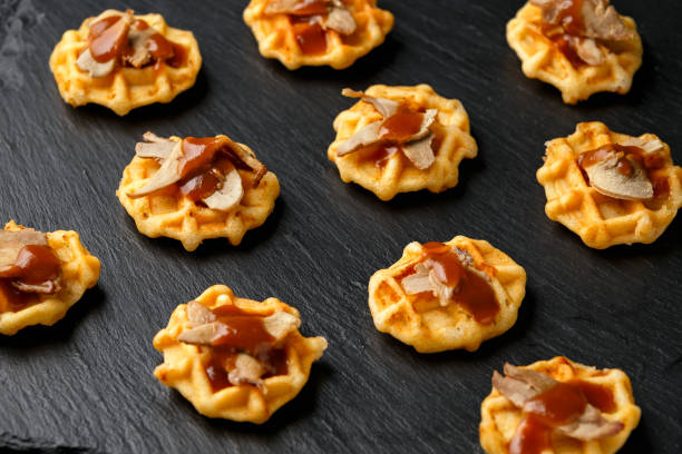 istock Mini waffle duck party food on rustic stone background 1292235571