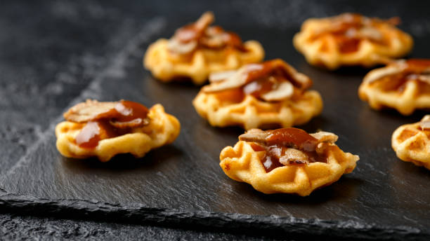 istock Mini waffle duck party food on rustic stone background 1292235580
