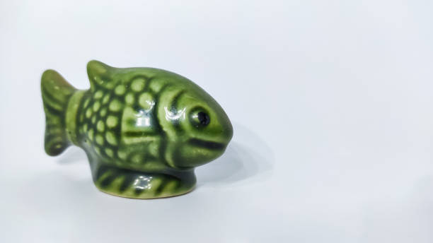 istock statue of fish in a white isolated background 1292237392