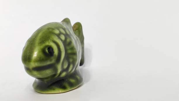 istock statue of fish in a white isolated background 1292237488
