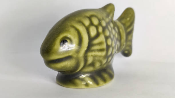istock statue of fish in a white isolated background 1292237519