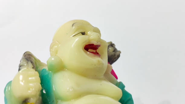 istock statue of laughing buddha in white isolated background 1292237783