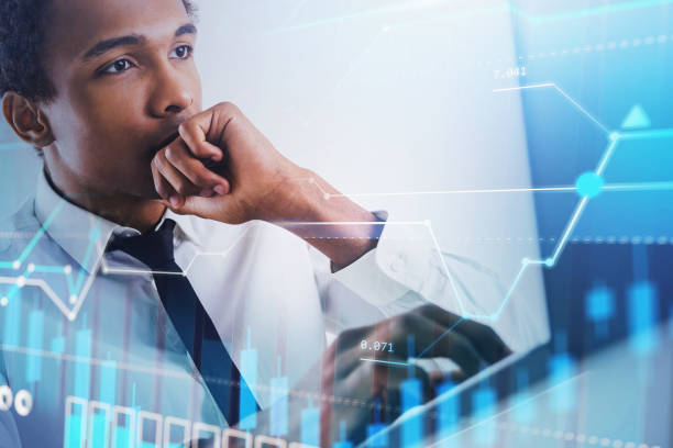 istock Thoughtful African man in office and graph 1292238699