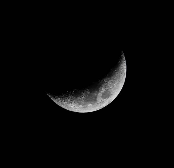 istock Craters Visible on the Lunar Landscape seen on a Crescent Moon 1292238875