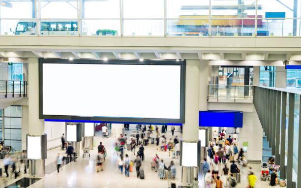 istock Blurred people and blank billboard in airport 1292240630