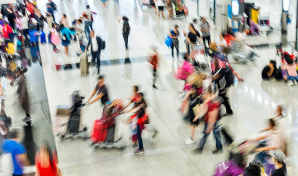 istock Group of people walking in airport 1292240821