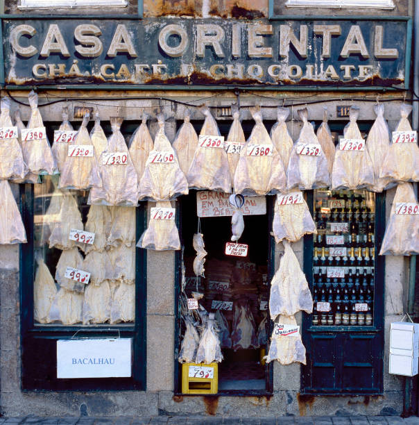 PORTO,PORTUGAL-OCTOBER 17,2001: Old fashioned bacalhau shop with outside hanging bacalhau