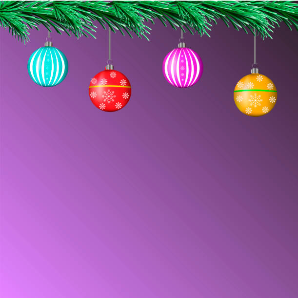 istock Banner - pine branches with Christmas balls on a purple background 1292244655