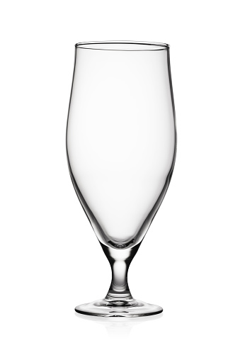 Empty shot glass isolated on white background.