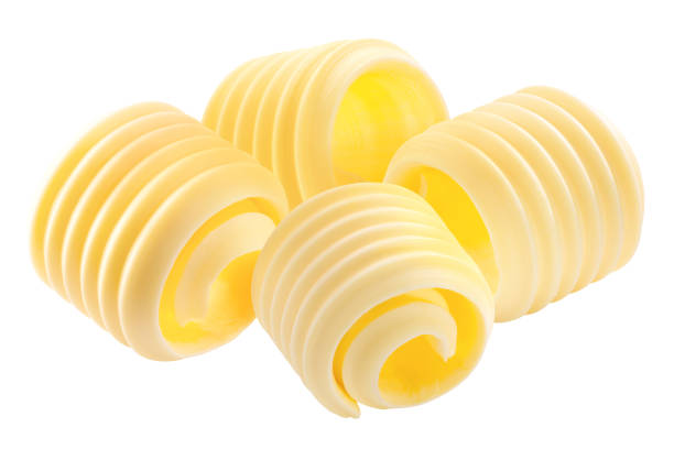 istock Butter curls rolled up, a group of four,  isolated 1292246855