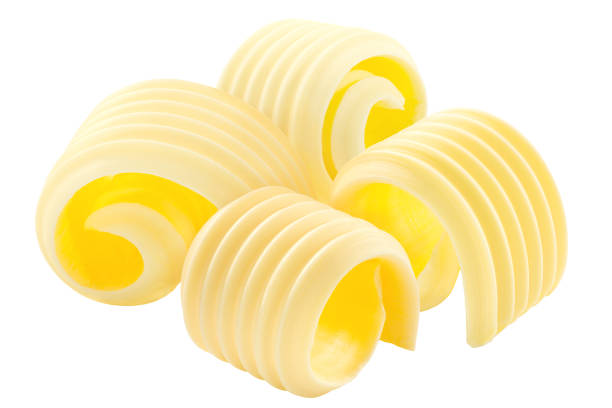 istock Butter curls rolled up, a group of four,  isolated 1292246867