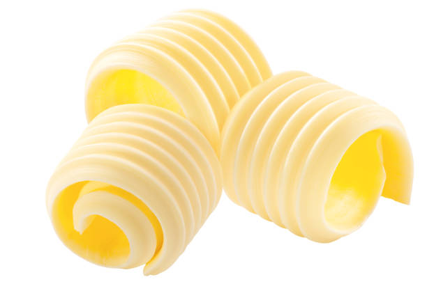 istock Butter curls rolled up, a group of three,  isolated 1292246880