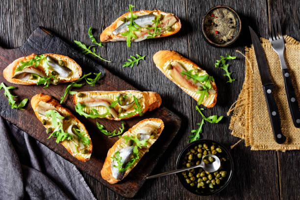 istock anchovy butter open sandwiches with fresh arugula leaves 1292247244
