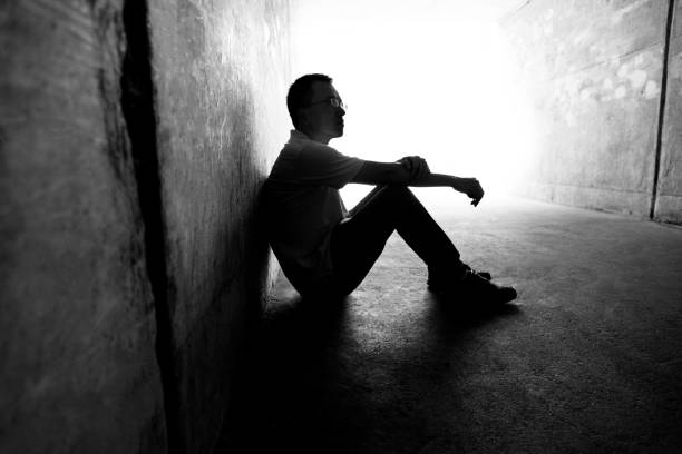 istock Desperate man sitting in the tunnel 1292248296