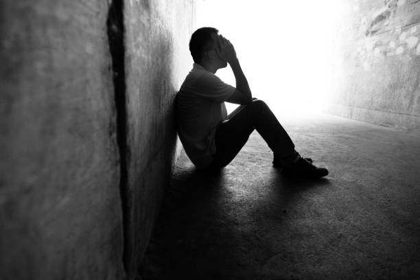 istock Desperate man sitting in the tunnel 1292248313